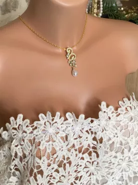 Collier de dos Vespera – Design spiralé en strass sur chaîne fine dorée Bijou élégant