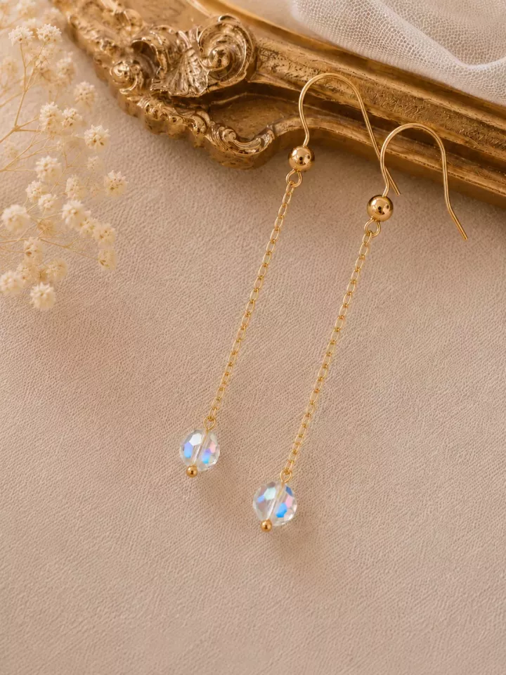Boucles d’oreilles de mariée Iris – Pendantes avec cristal transparent.
